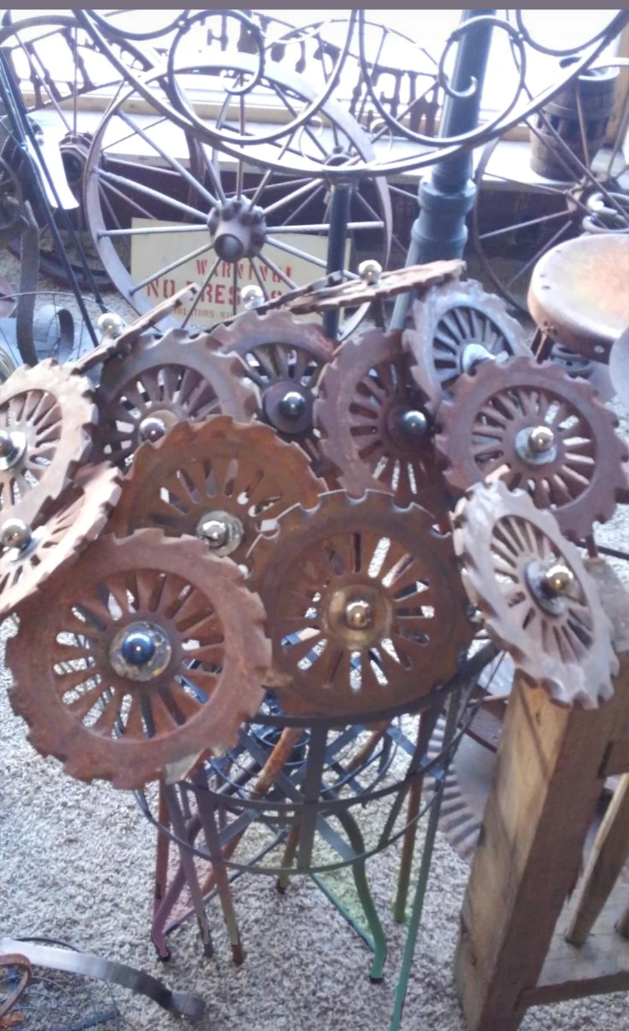 Cluster of metal gears assembled as garden art