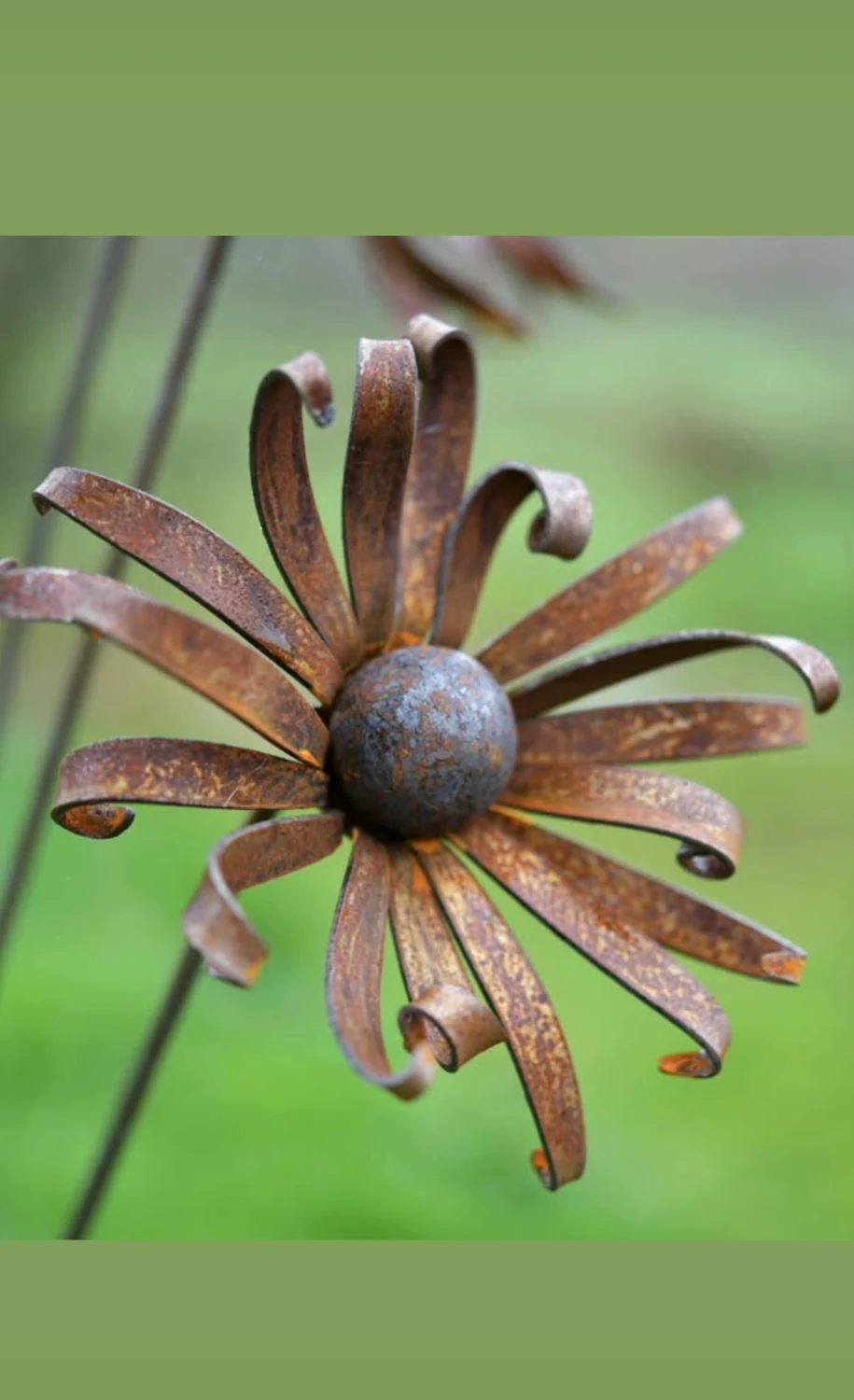 Small metal flower with curved spiral petals