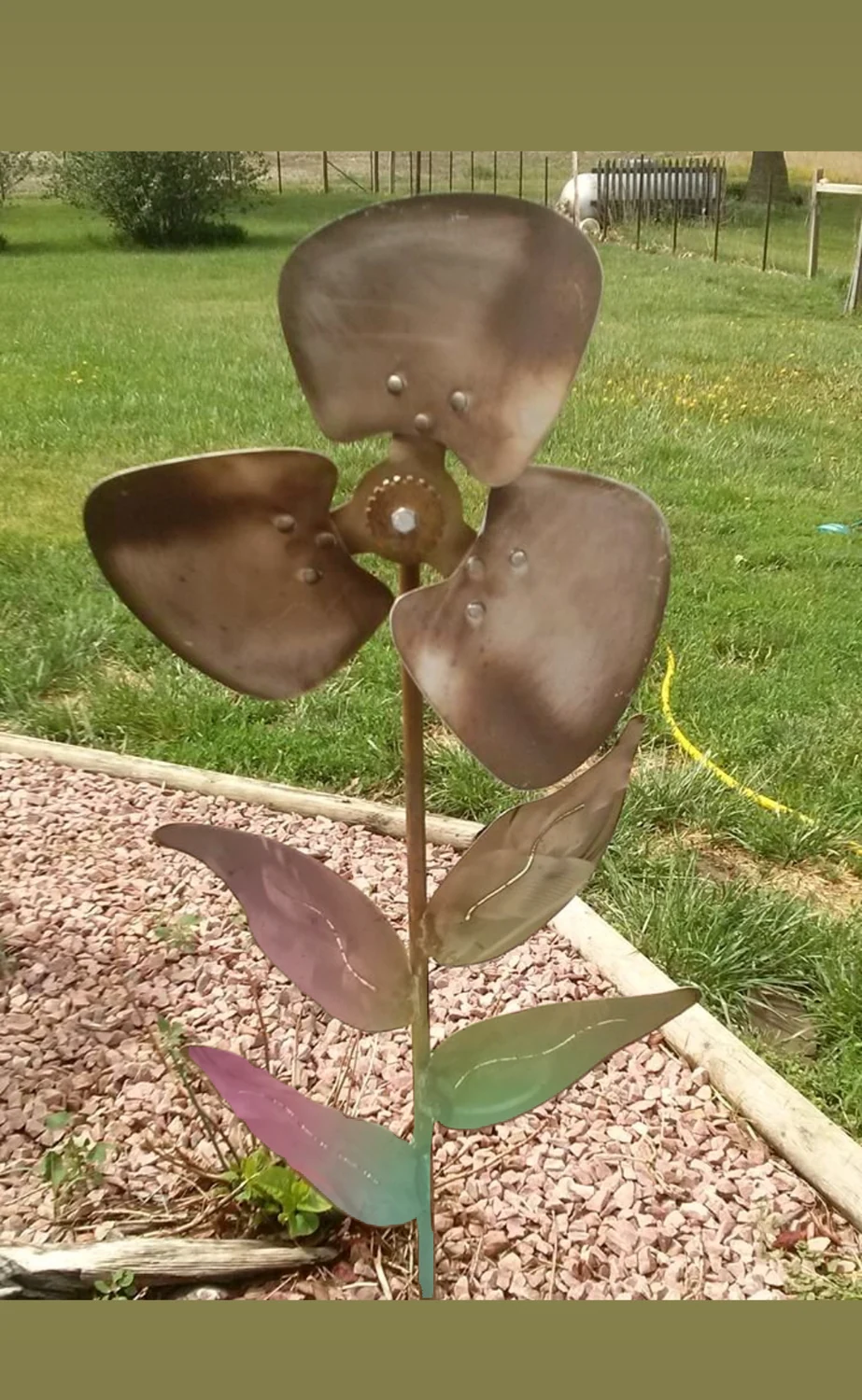 Three petal metal flower sculpture